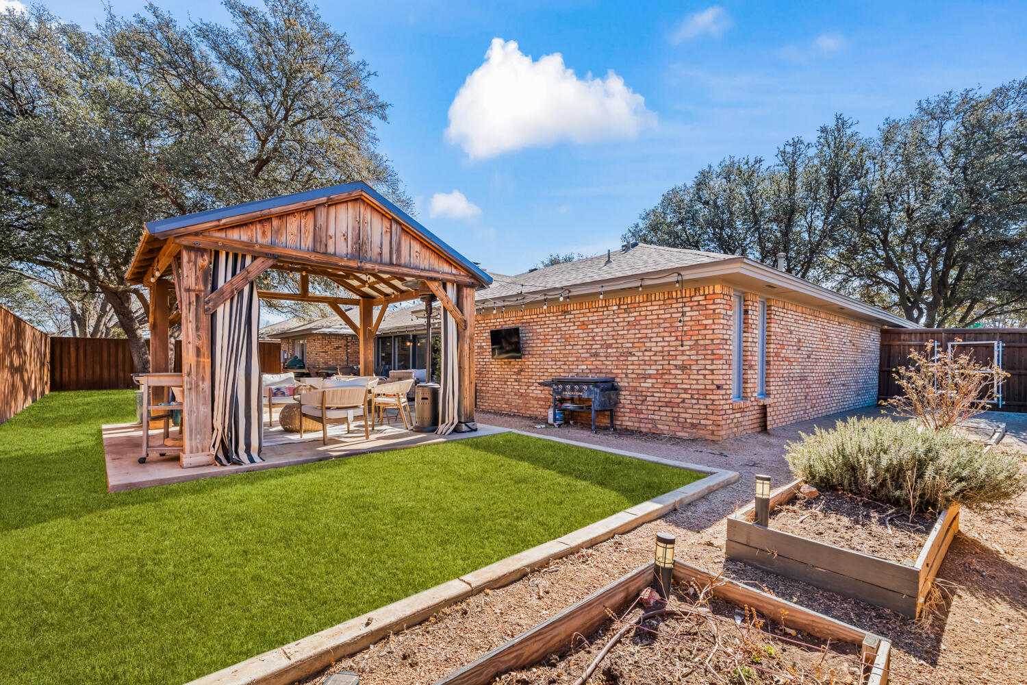 3114 76th Street Lubbock, TX 79423 - Photo 70 of 77 a view of a house with a yard porch and sitting area