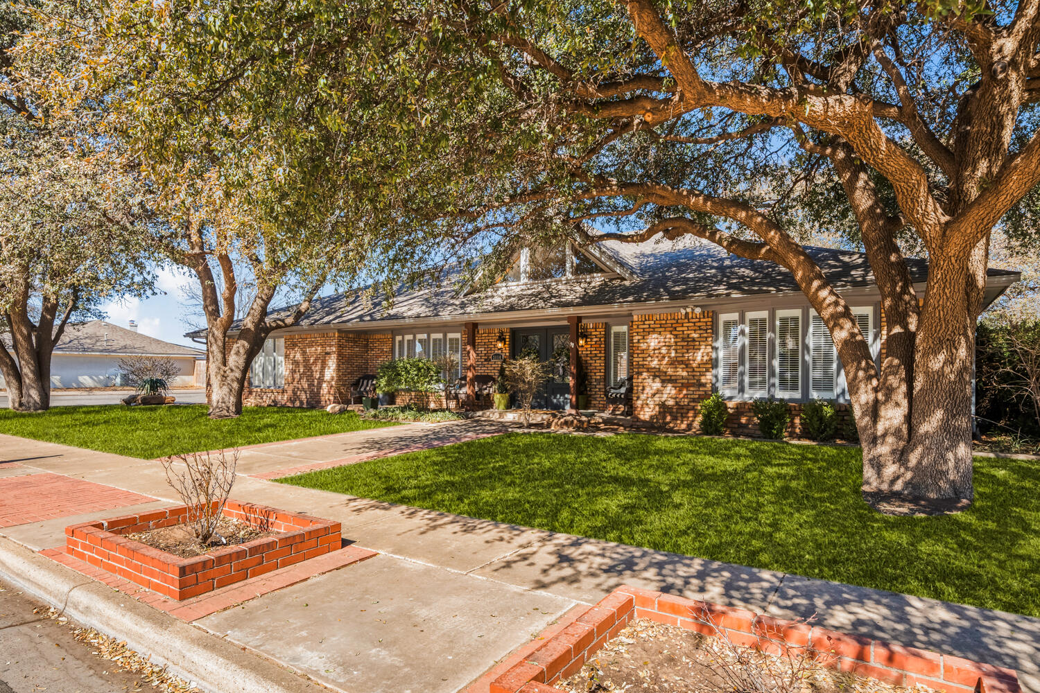 3114 76th Street Lubbock, TX 79423 - Photo 75 of 77 a front view of a house with a yard