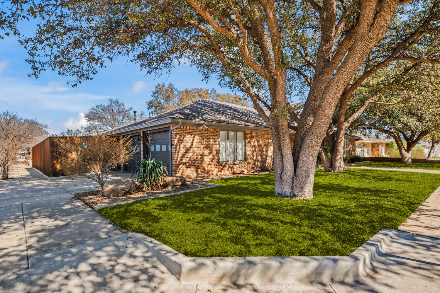 3114 76th Street Lubbock, TX 79423 - Photo 76 of 77 a backyard of a house with lots of green space