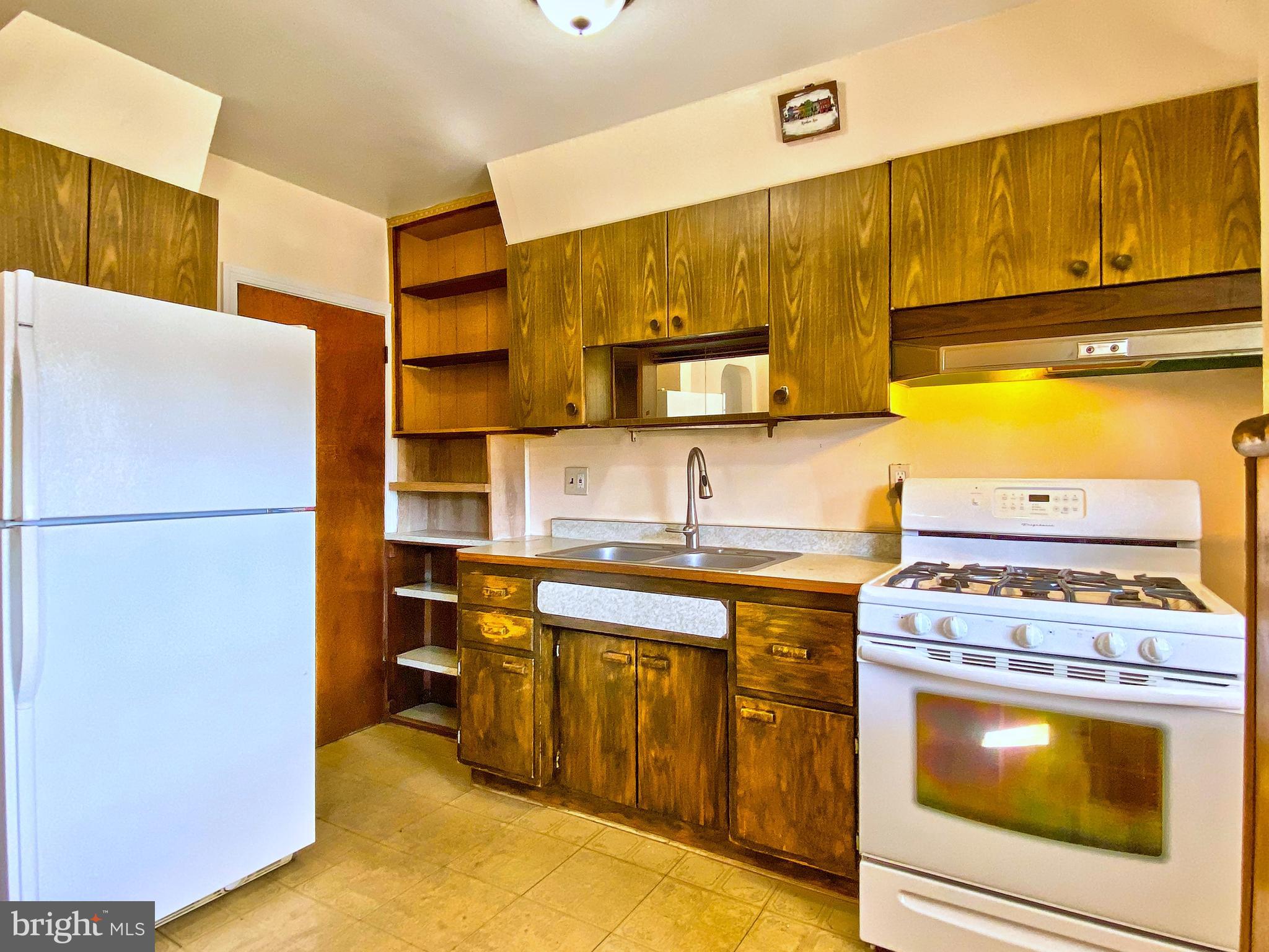 1917 Inverton Road Baltimore, MD 21222 - Photo 22 of 51 a kitchen with a stove top oven sink and refrigerator