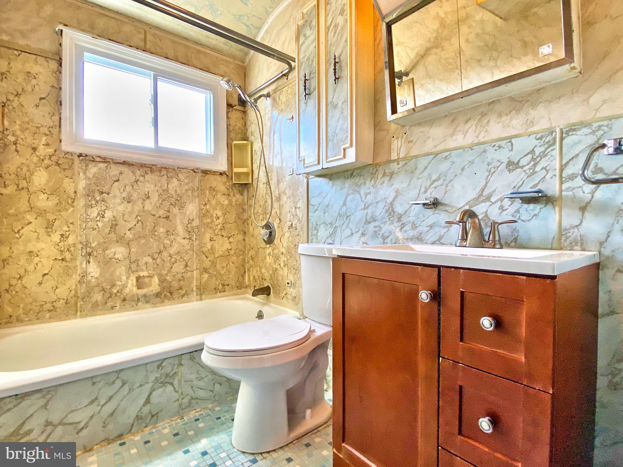 1917 Inverton Road Baltimore, MD 21222 - Photo 40 of 51 a bathroom with a sink toilet and shower