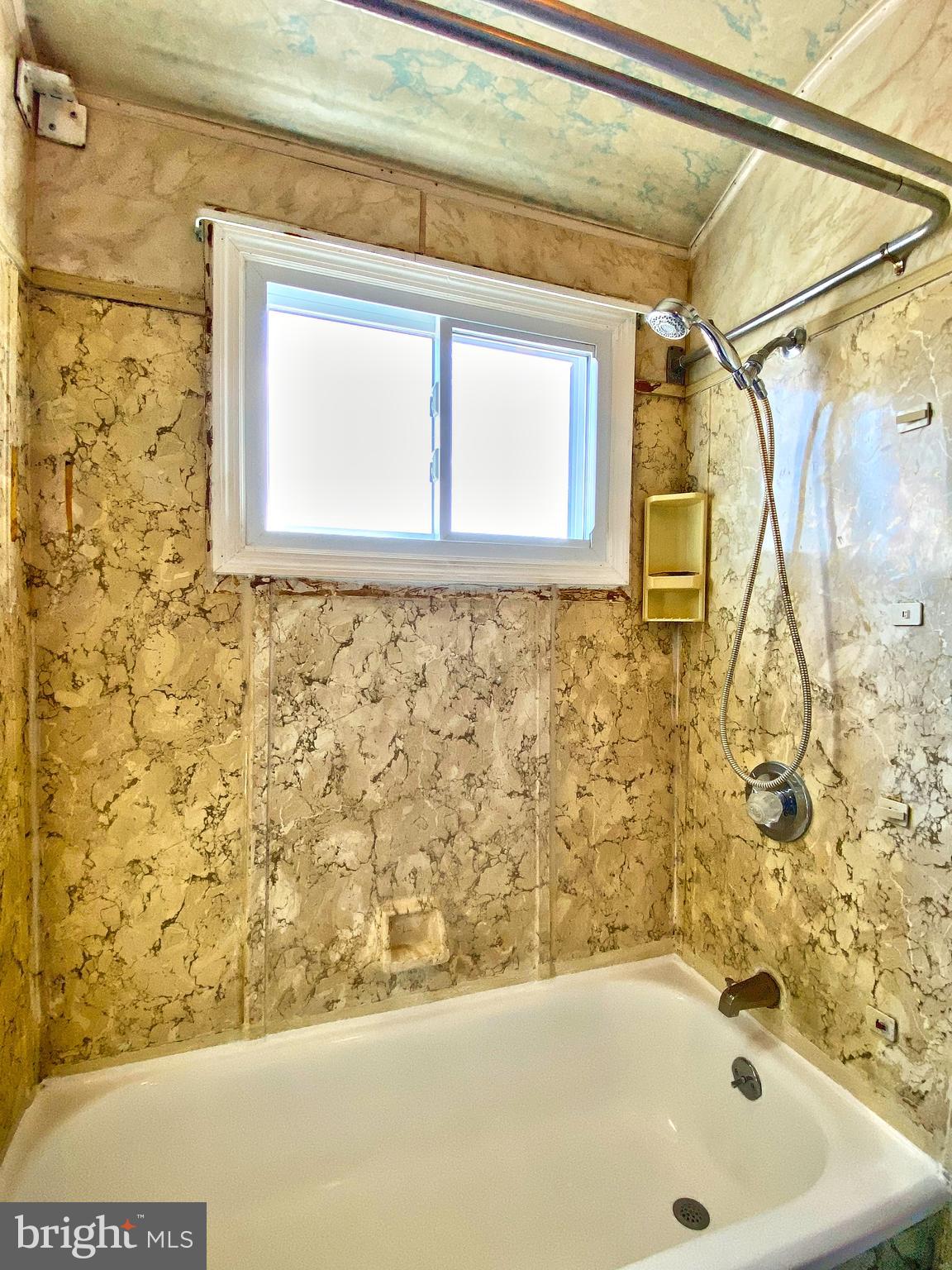 1917 Inverton Road Baltimore, MD 21222 - Photo 42 of 51 a bathroom with a bathtub and shower