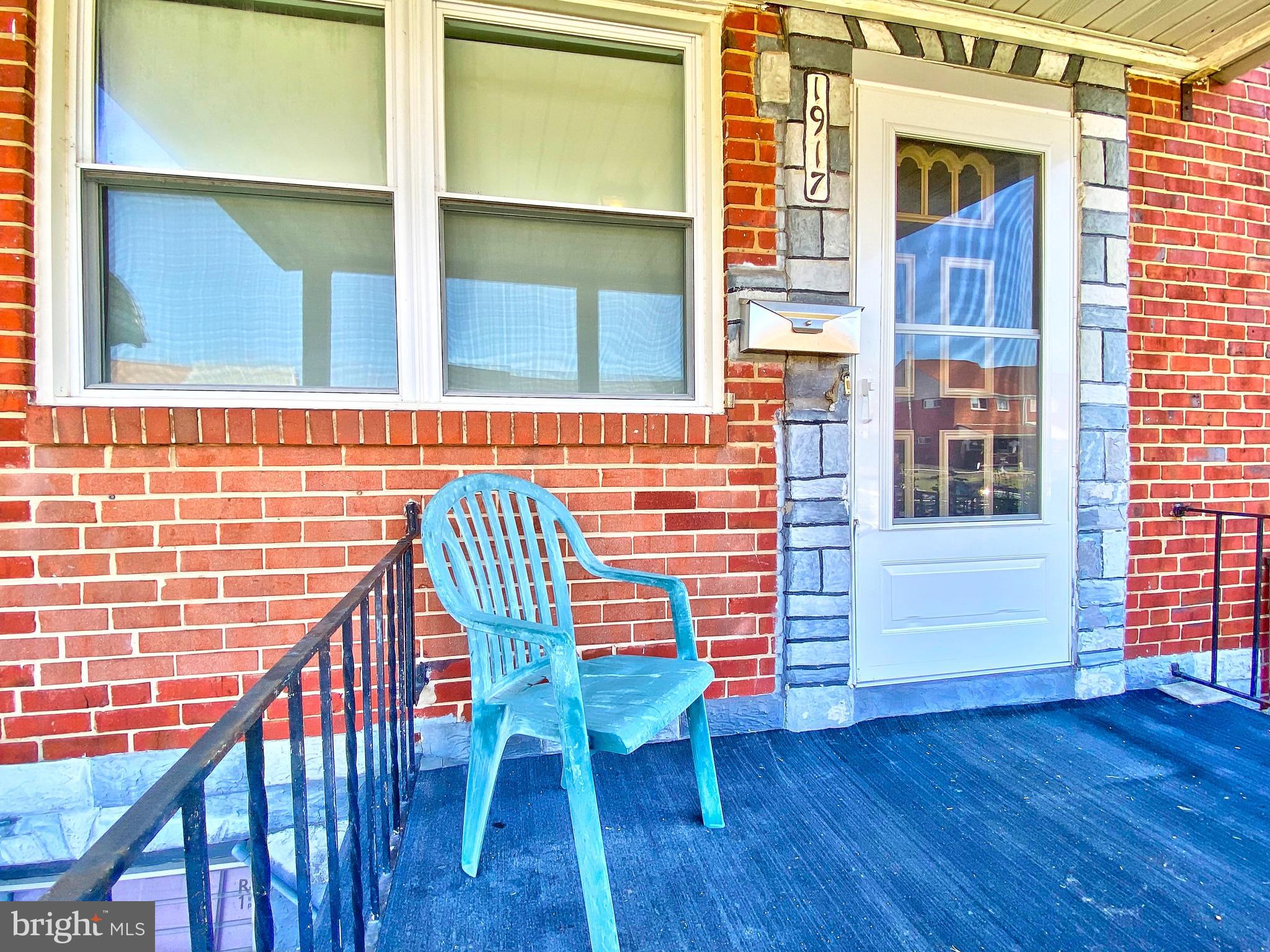 1917 Inverton Road Baltimore, MD 21222 - Photo 9 of 51 a view of a balcony with chair and table