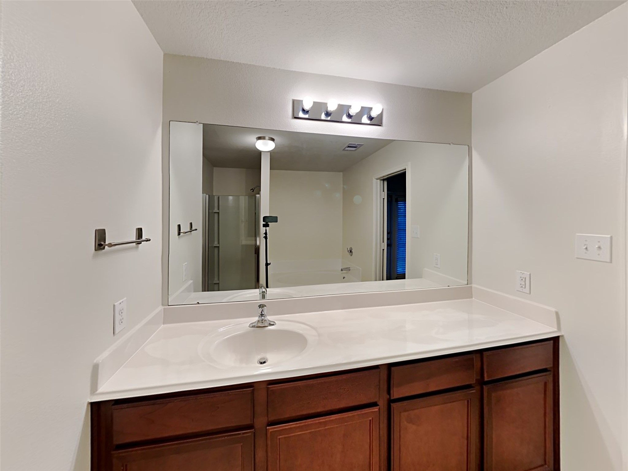 22718 Klingamans Way Hockley, TX 77447 - Photo 13 of 20 a bathroom with a sink and a mirror