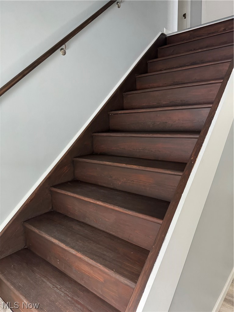 11249 Prouty Road Painesville, OH 44077 - Photo 10 of 16 Stairs featuring wood-type flooring
