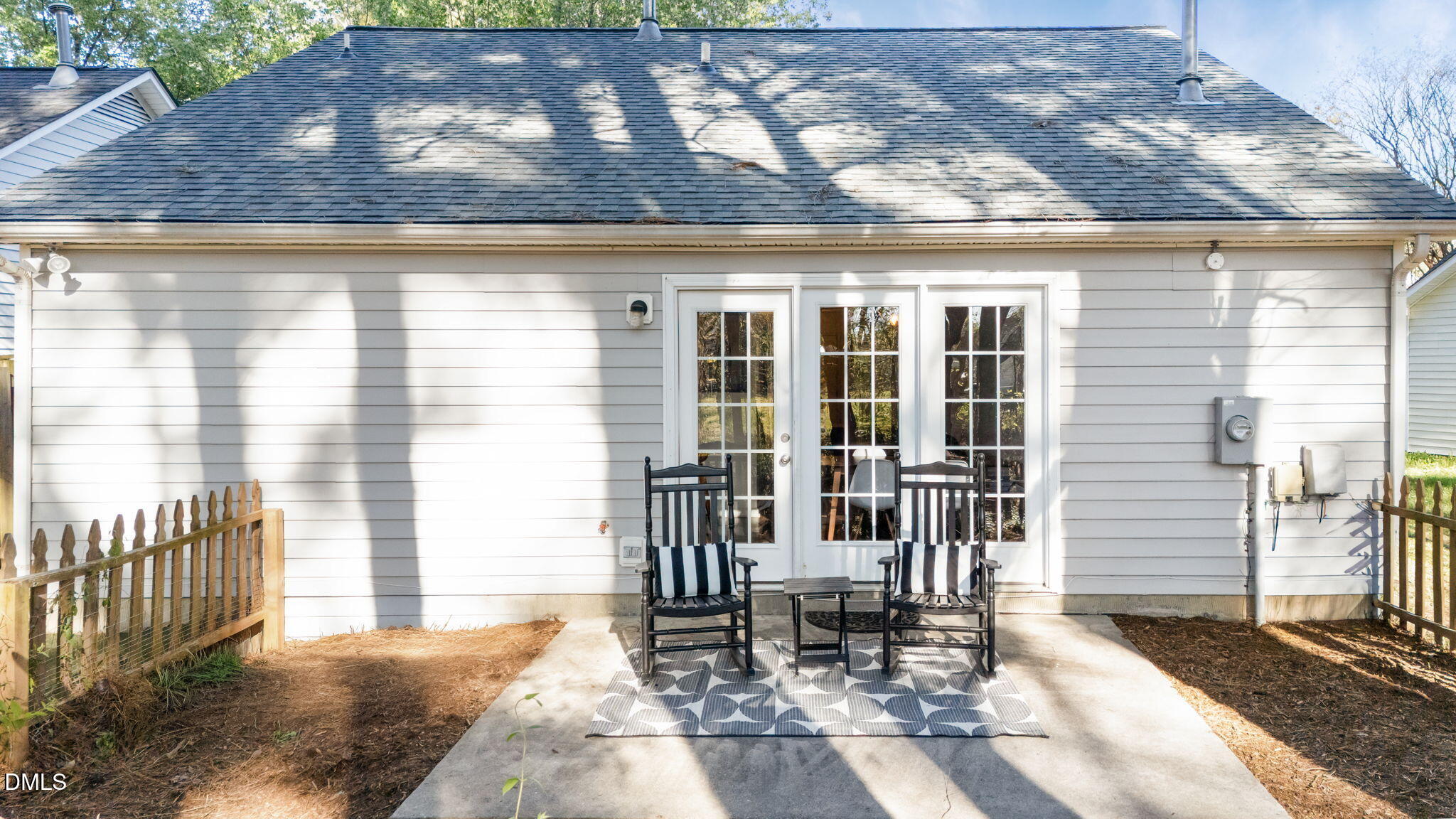 2208 Walnut Ridge Court Raleigh, NC 27610 - Photo 9 of 24 a balcony with table and chairs and potted plants