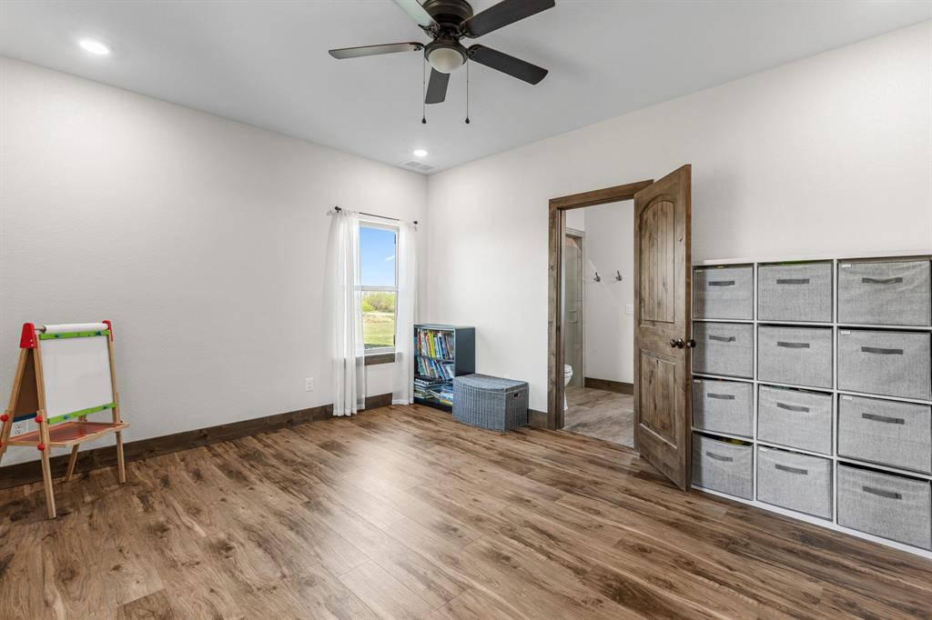 515 Sales Road Windthorst, TX 76389 - Photo 25 of 34 a view of a livingroom with an empty space and a workspace