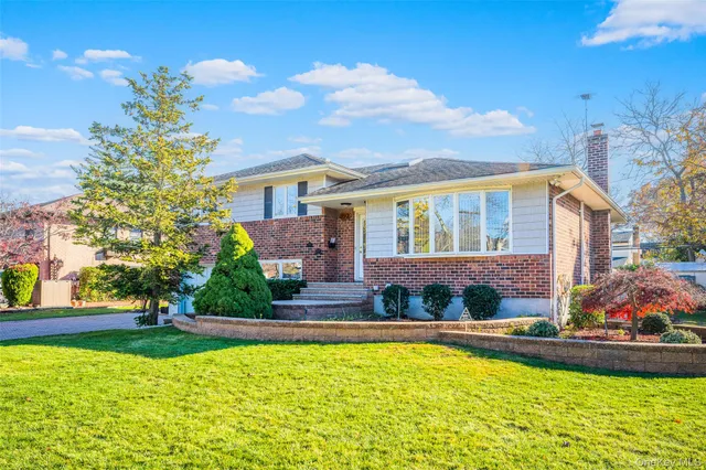 a house view with swimming pool and garden space