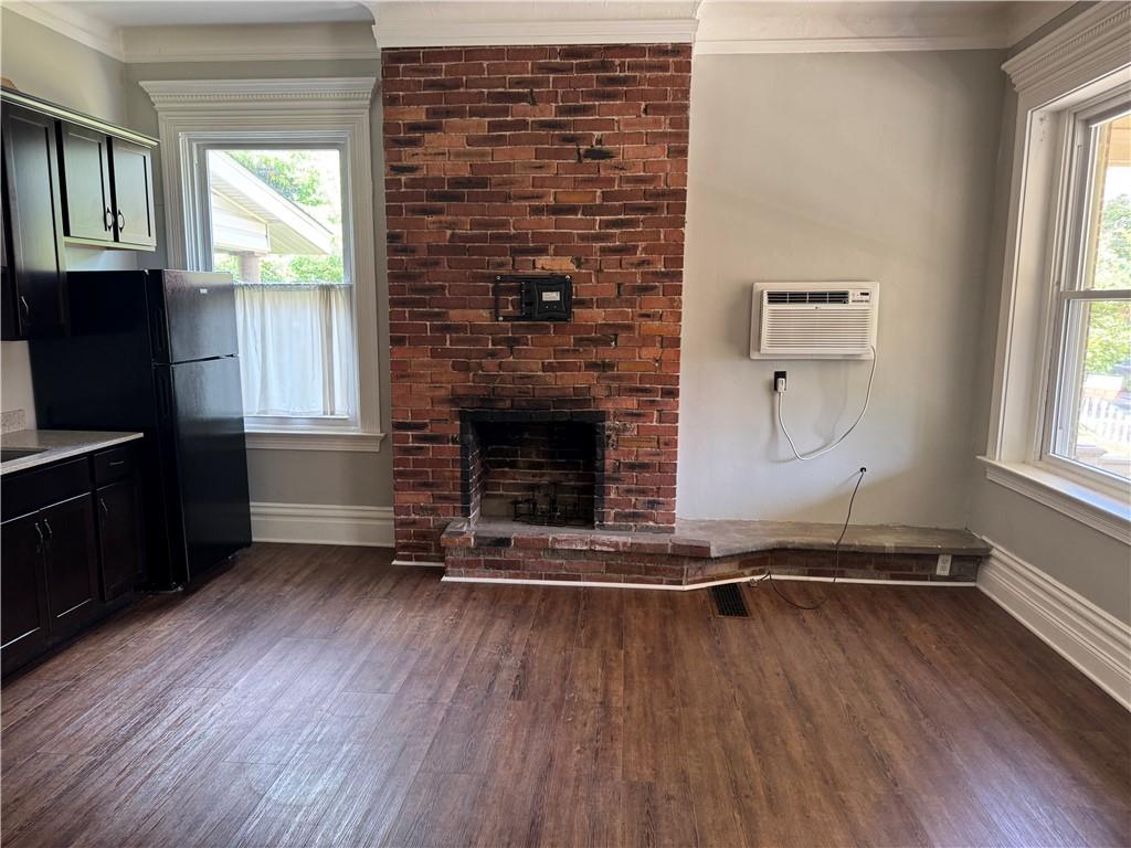 342 South Graham Street Pittsburgh, PA 15232 - Photo 6 of 9 an empty room with wooden floor fireplace and windows