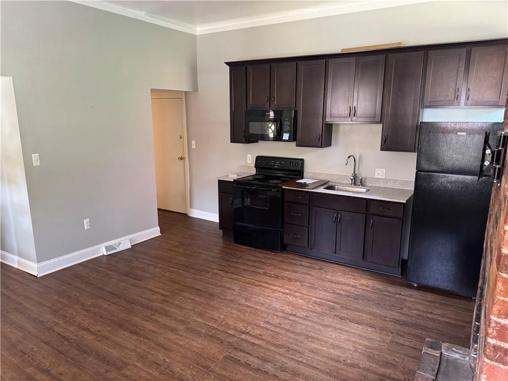 342 South Graham Street Pittsburgh, PA 15232 - Photo 8 of 9 a kitchen with stainless steel appliances granite countertop a sink stove and refrigerator