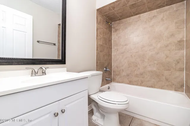 a bathroom with a sink a toilet and a bathtub
