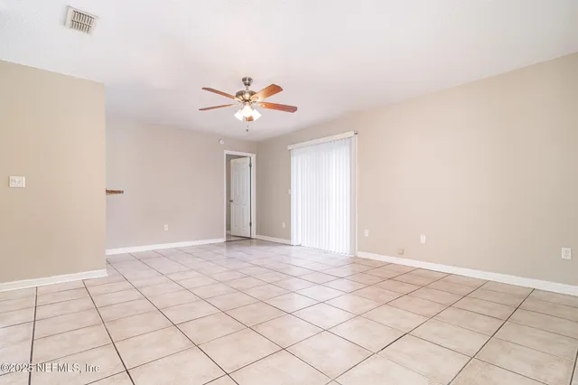 a view of an empty room and window