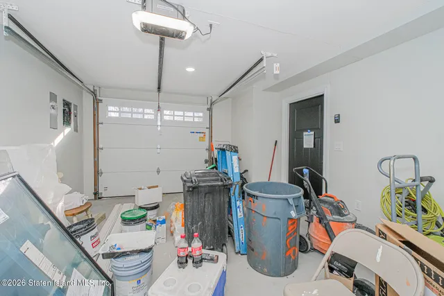 a dining room with furniture a chandelier and wooden floor