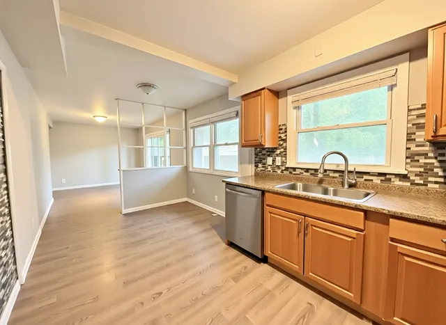 a kitchen with sink and window