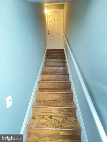 a view of front door with wooden floor