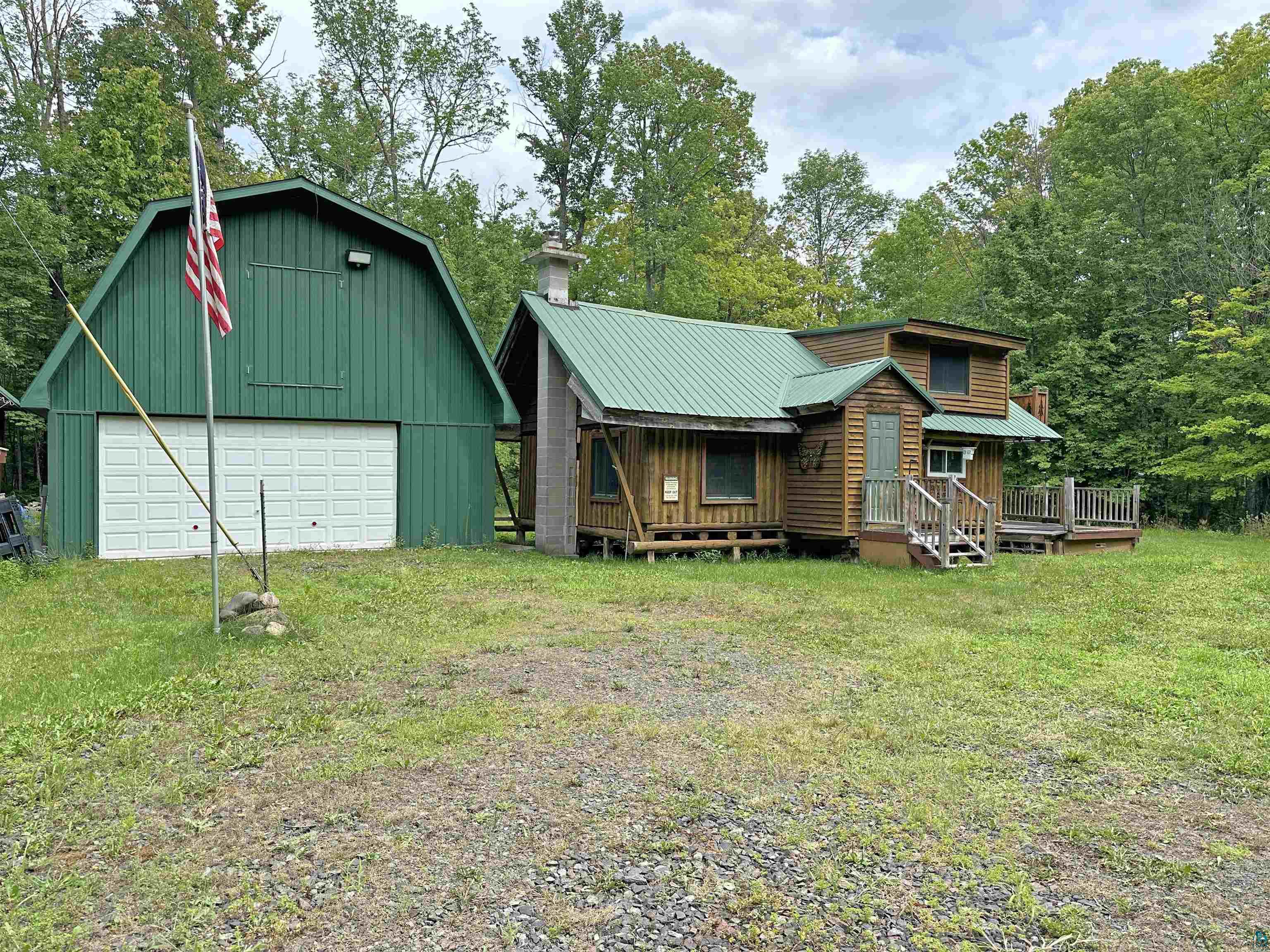 80590 Lenawee Road Herbster, WI 54844 - Photo 1 of 36 Back of house with a garage and a yard