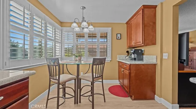 a balcony with table and chairs