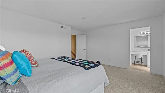 a bedroom with a bed and a view of bathroom