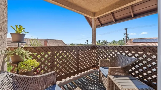a view of a chairs and table in the patio