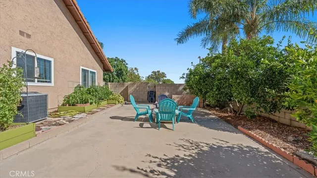 a view of a backyard with a sitting area and furniture