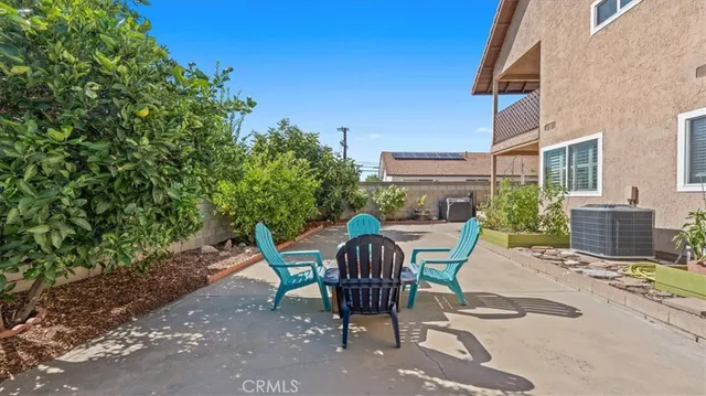 a view of a chairs and table in the patio