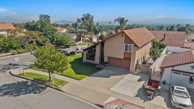 an aerial view of a house with swimming pool