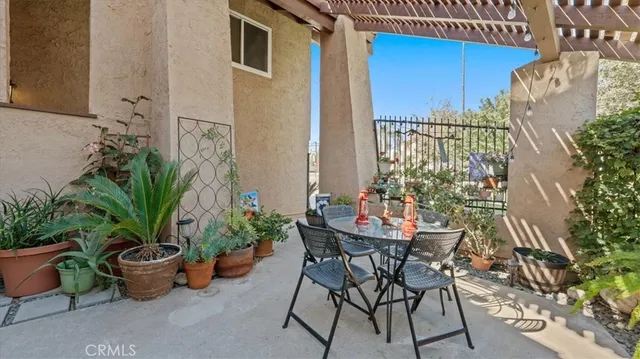 a view of a backyard with furniture and a potted plants