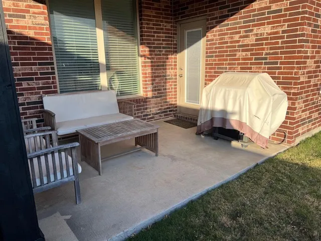 a view of backyard with sitting area