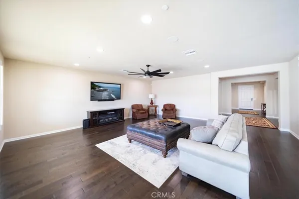 a large kitchen with a table and chairs