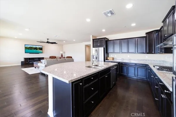 a stove top oven sitting inside of a kitchen