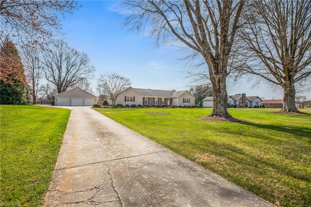 3406 Edgefield Road Greensboro, NC 27409 - Photo 4 of 34 A long driveway and of space, a good distance from the road !