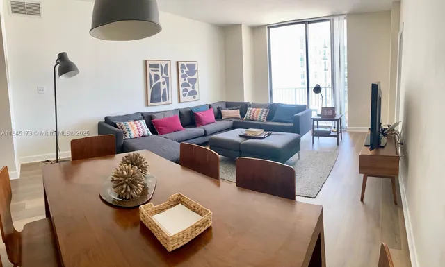 a living room with furniture and a window