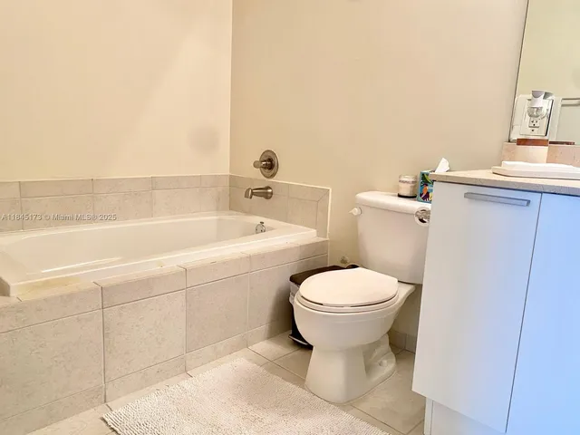 a bathroom with a toilet sink and bathtub