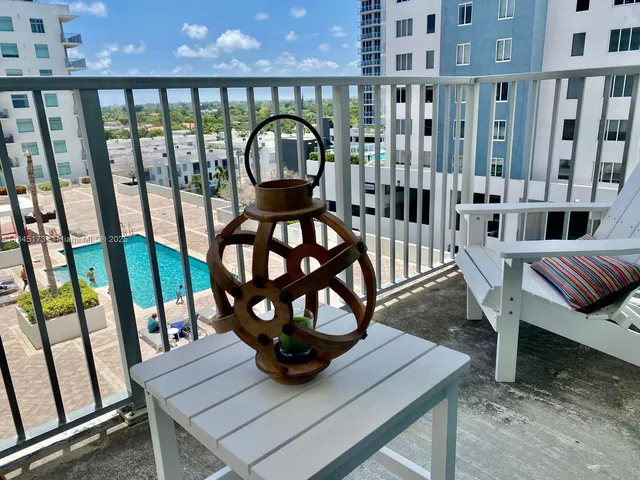 a view of a living room and wooden floor