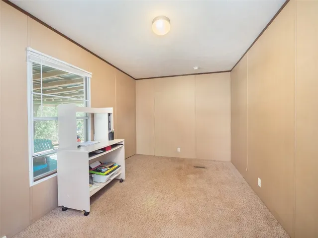 a room with furniture and a window