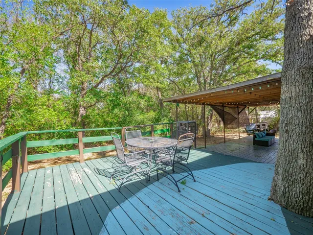 a view of outdoor space with wooden floor and outdoor seating