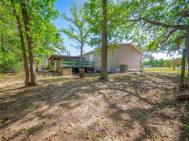 a view of backyard with outdoor space
