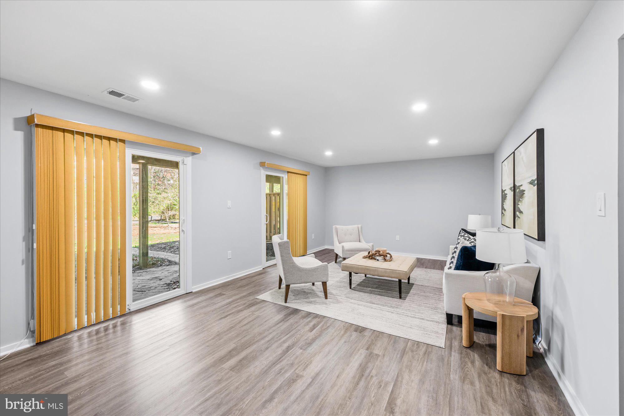 1431 Greenmont Court Reston, VA 20190 - Photo 12 of 16 a living room with furniture and wooden floor