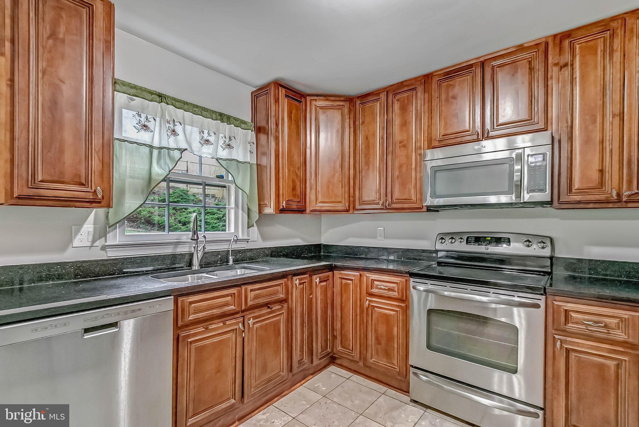 2608 Village Lane Silver Spring, MD 20906 - Photo 15 of 43 Kitchen with stainless appliances