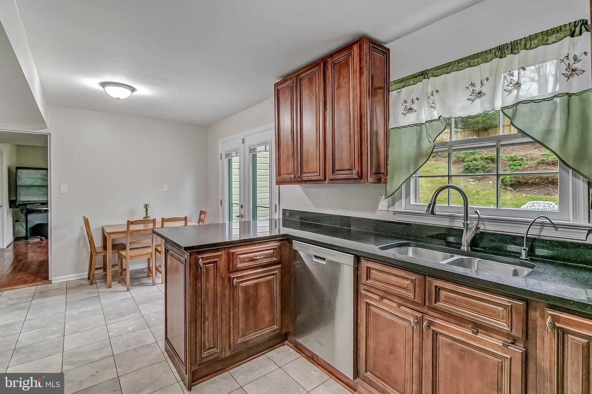 2608 Village Lane Silver Spring, MD 20906 - Photo 16 of 43 Table space kitchen with exit to backyard