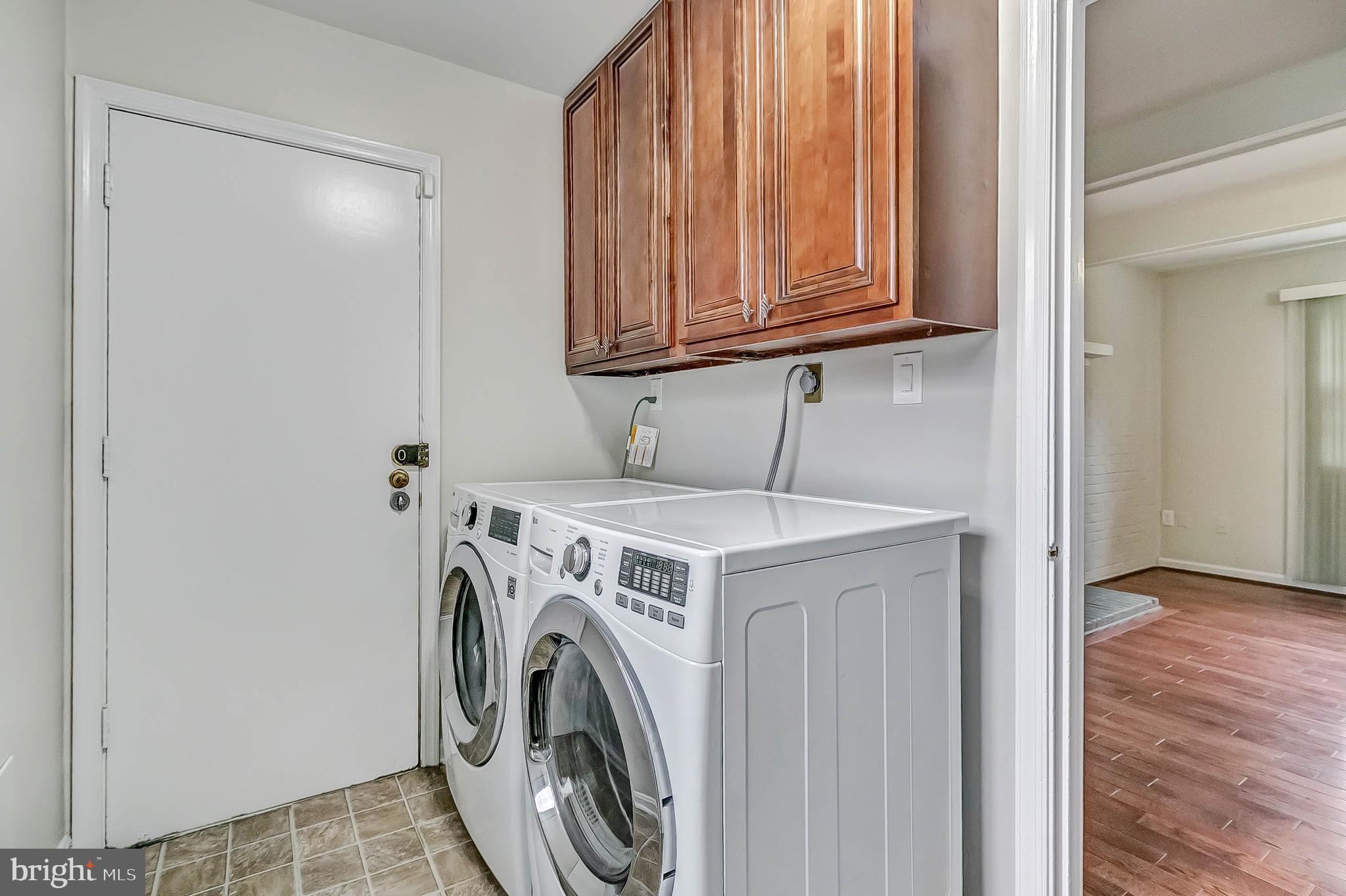 2608 Village Lane Silver Spring, MD 20906 - Photo 23 of 43 Laundry room with extra storage cabinets