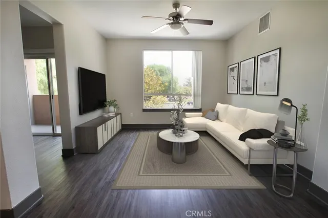 a living room with furniture and a large window