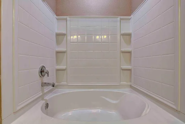a bathroom with bathtub