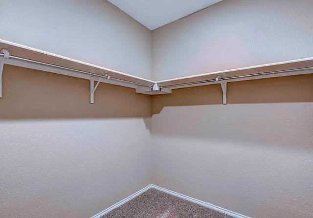 a view of a room with racks on the wall