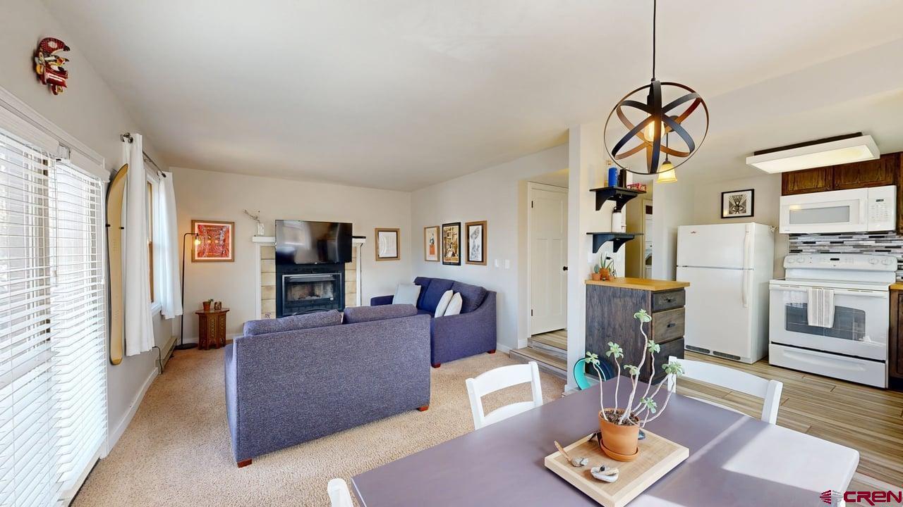 6 Ferringway Circle, Unit 47 Durango, CO 81301 - Photo 1 of 20 a living room with furniture and wooden floor