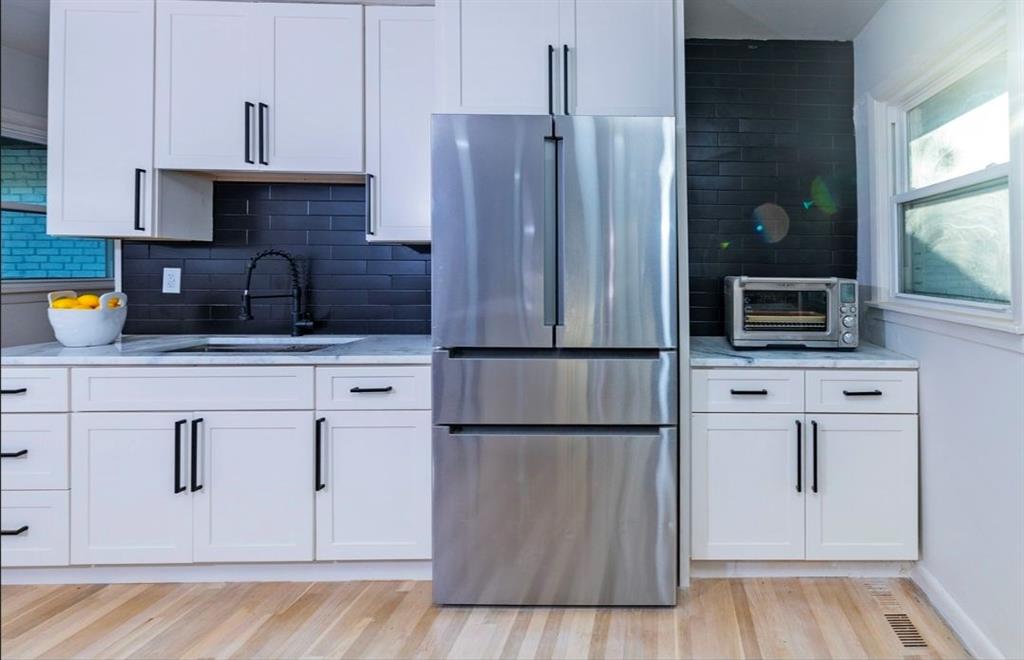 3807 Greenhill Drive Atlanta, GA 30341 - Photo 11 of 18 a kitchen with stainless steel appliances granite countertop a refrigerator and a stove top oven