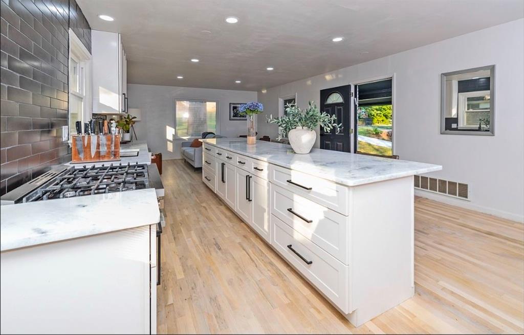 3807 Greenhill Drive Atlanta, GA 30341 - Photo 8 of 18 a large white kitchen with stainless steel appliances double vanity and a sink