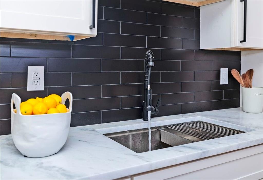 3807 Greenhill Drive Atlanta, GA 30341 - Photo 9 of 18 a view of a sink and dishwasher with wooden floor