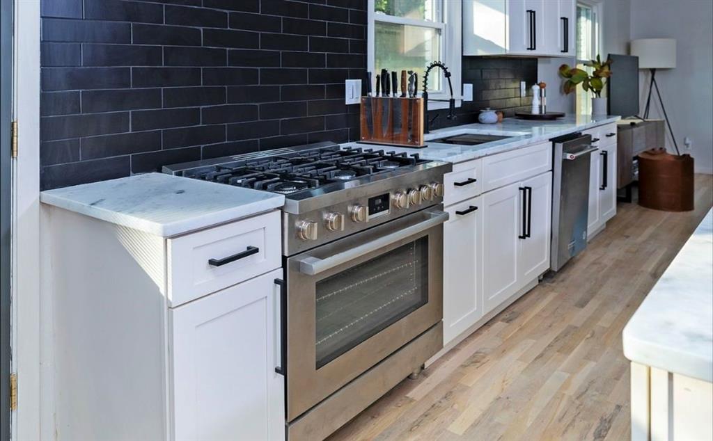 3807 Greenhill Drive Atlanta, GA 30341 - Photo 10 of 18 a stove top oven sitting inside of a kitchen