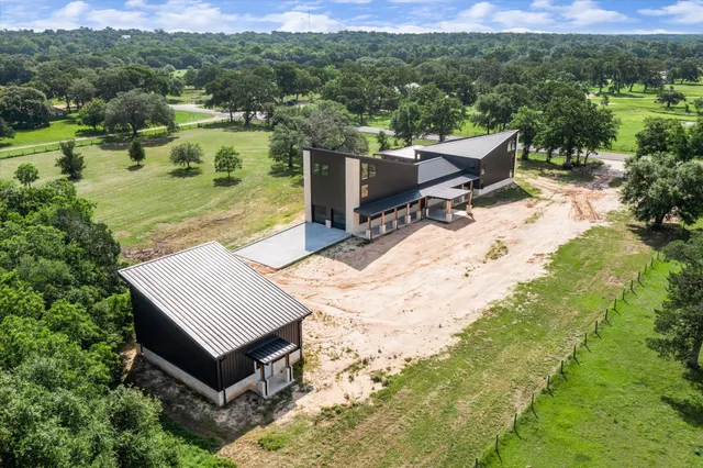 a view of a terrace with a garden and trees